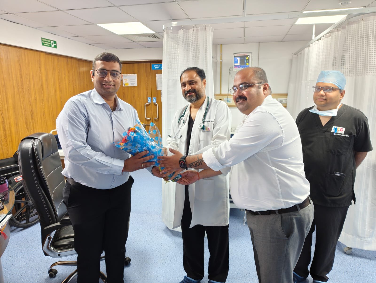 Dr. Sumit Bhatnagar being felicitated in a hospital setting